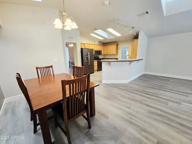 a view of room with window and hardwood floor