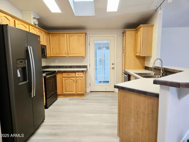 a view of swimming pool with outdoor seating and plants