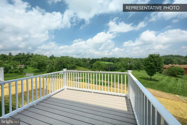 a view of a balcony with wooden fence