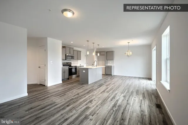 a view of kitchen with wooden floor