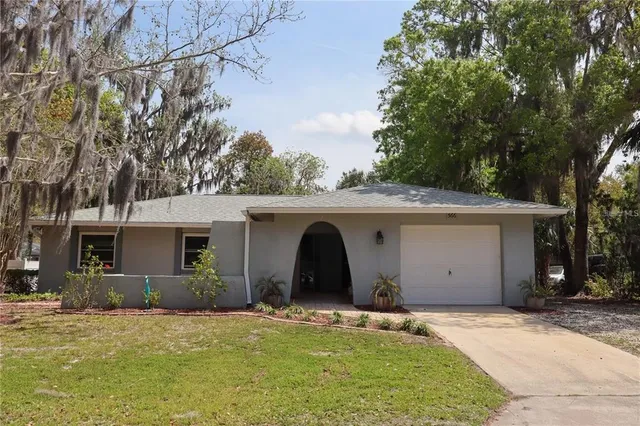 a view of garage and yard