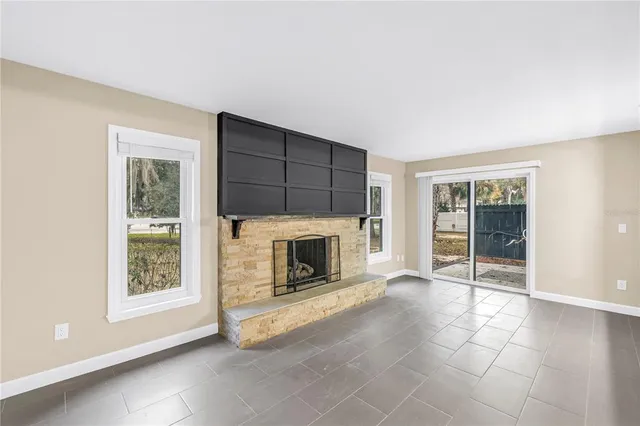 an empty room with windows and view