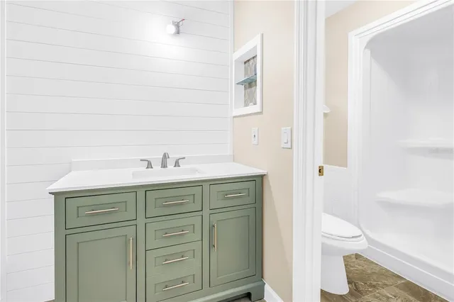 a bathroom with a sink and vanity