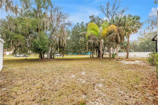 aerial view of a house with a yard