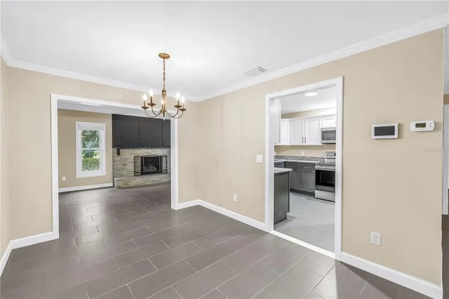 a kitchen with stainless steel appliances granite countertop a sink and stove top oven