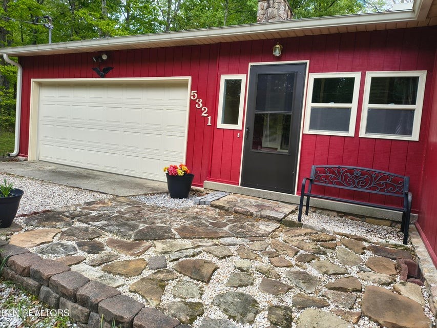 5321 Pawnee Road Crossville, TN 38572 - Photo 5 of 11 a house with trees in the background