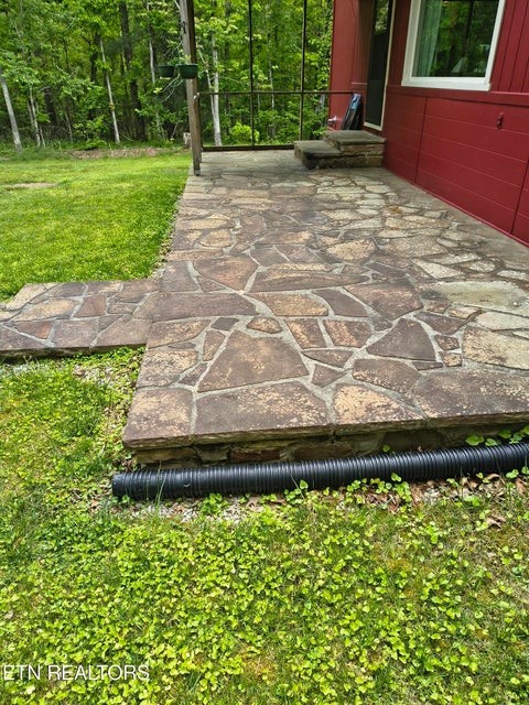 5321 Pawnee Road Crossville, TN 38572 - Photo 9 of 11 a wooden bench sitting in the middle of a yard
