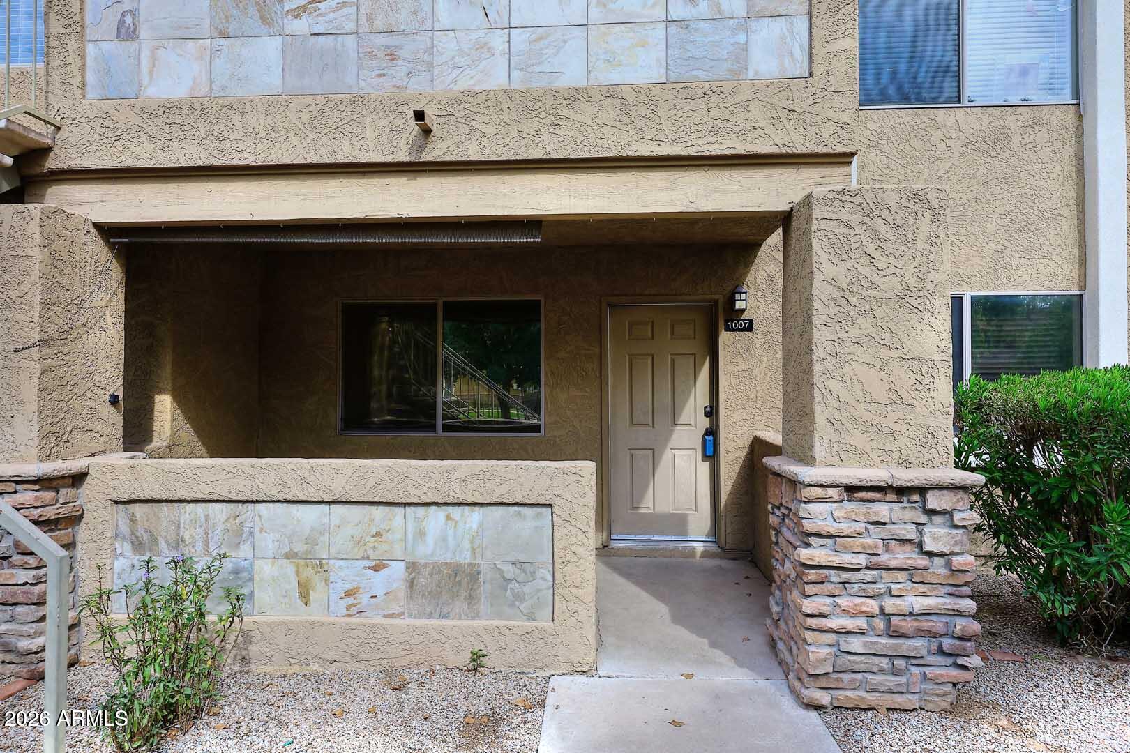 303 North Miller Road, Unit 1007 Scottsdale, AZ 85257 - Photo 3 of 45 front view of a house with a window