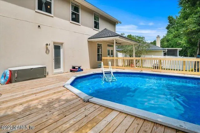 a view of a house with swimming pool