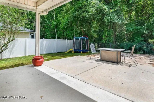 a backyard of a house with seating space