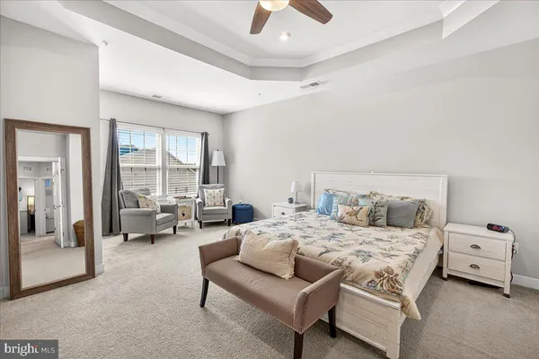 a bedroom with a bed and a couch