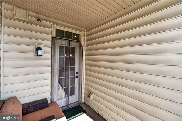a view of entryway with cabinets