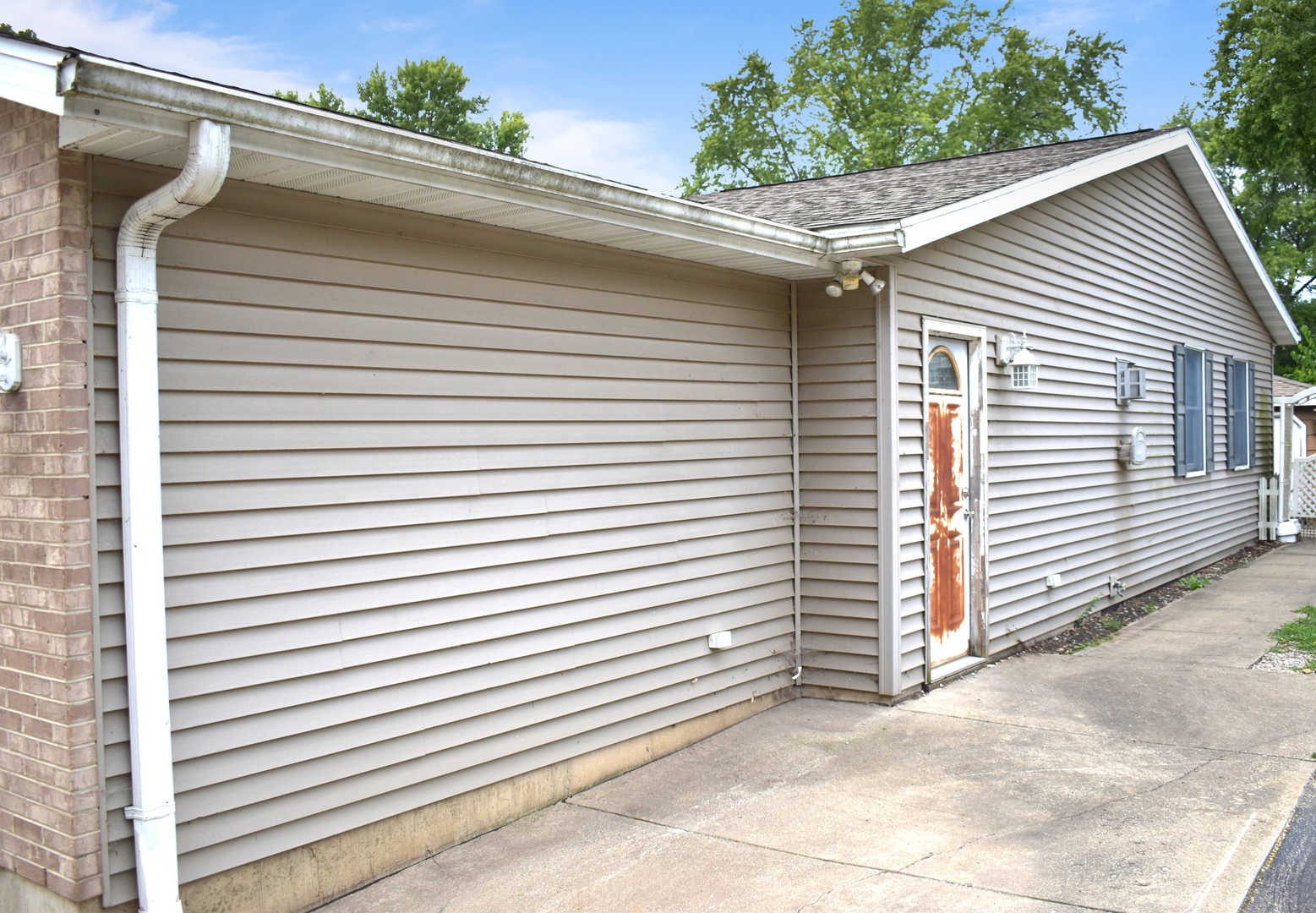 532 1st Street Marseilles, IL 61341 - Photo 5 of 24 a view of a white house with a large window and garage