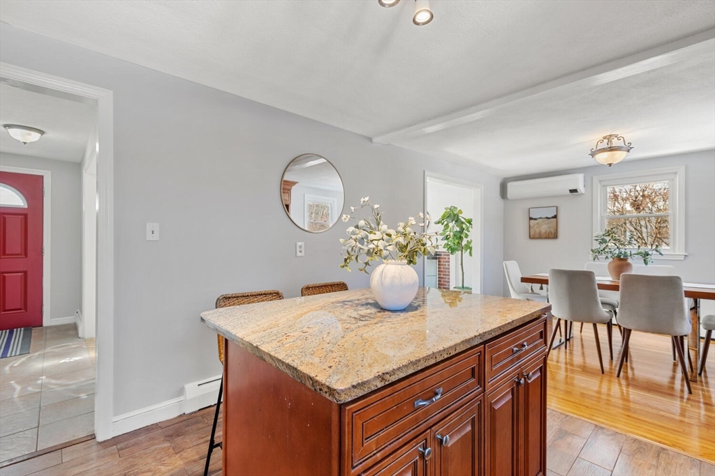 72 Grassland Street Lexington, MA 02421 - Photo 14 of 37 a kitchen with a table and chairs in it