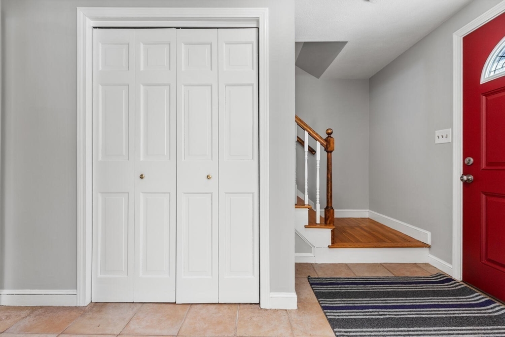 72 Grassland Street Lexington, MA 02421 - Photo 15 of 37 a view of a hallway with wooden floor and entryway