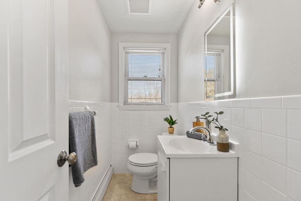 72 Grassland Street Lexington, MA 02421 - Photo 16 of 37 a bathroom with a sink toilet and window