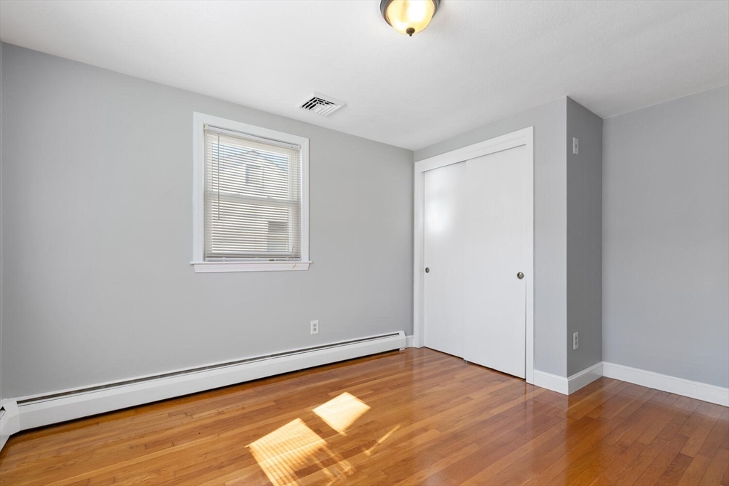 72 Grassland Street Lexington, MA 02421 - Photo 22 of 37 a view of room with window and wooden floor