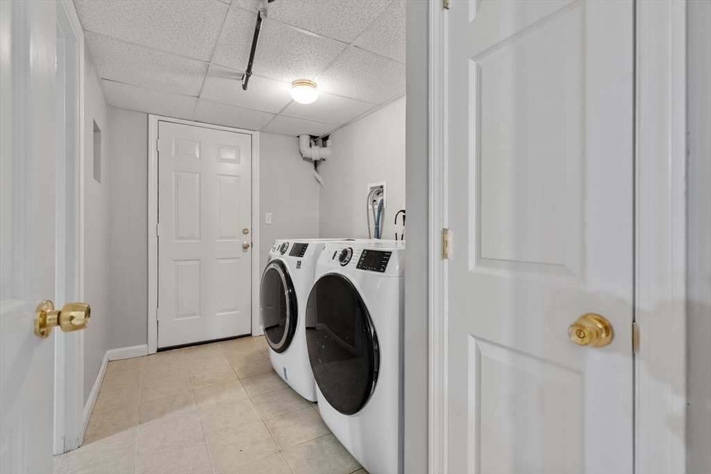 72 Grassland Street Lexington, MA 02421 - Photo 26 of 37 a view of a hallway with washer and dryer