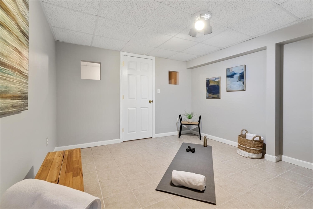 72 Grassland Street Lexington, MA 02421 - Photo 28 of 37 a living room with furniture and a window