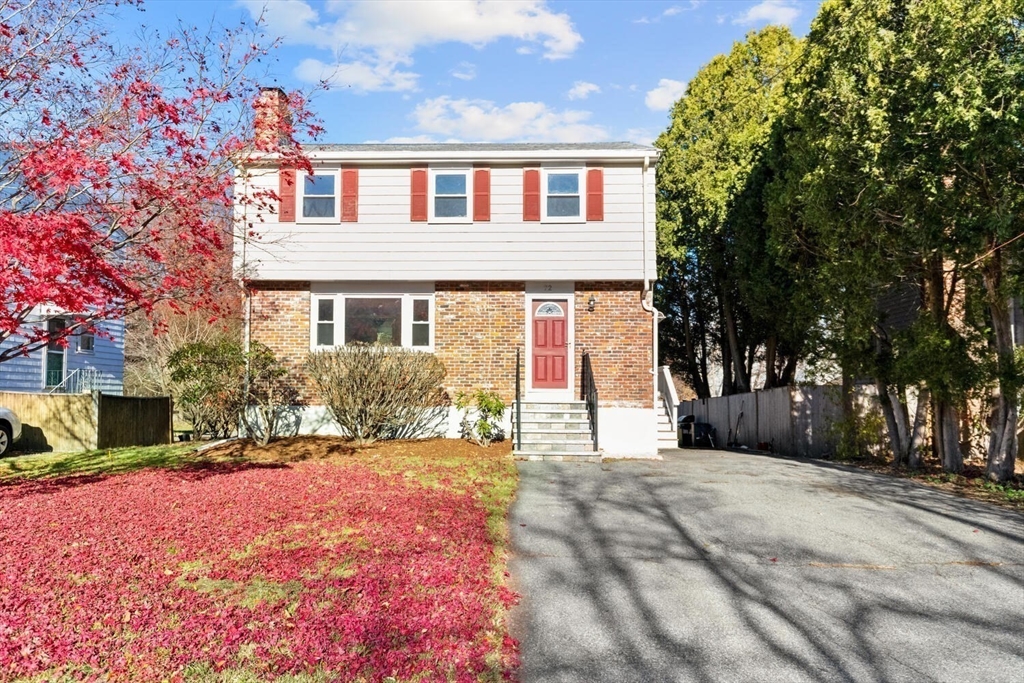 72 Grassland Street Lexington, MA 02421 - Photo 29 of 37 a front view of a house with a yard