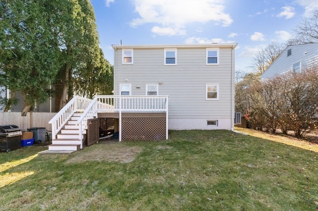 72 Grassland Street Lexington, MA 02421 - Photo 31 of 37 a view of a house with a bed and chairs