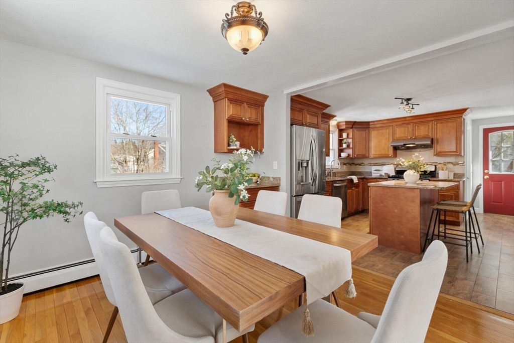72 Grassland Street Lexington, MA 02421 - Photo 8 of 37 a dining room with furniture a window and wooden floor