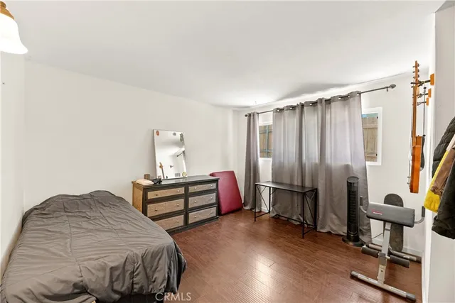 a bedroom with furniture and a closet