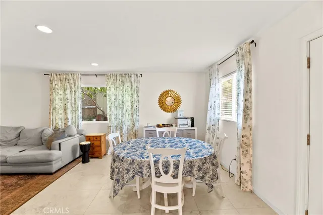 a bedroom with a bed and a wooden floor