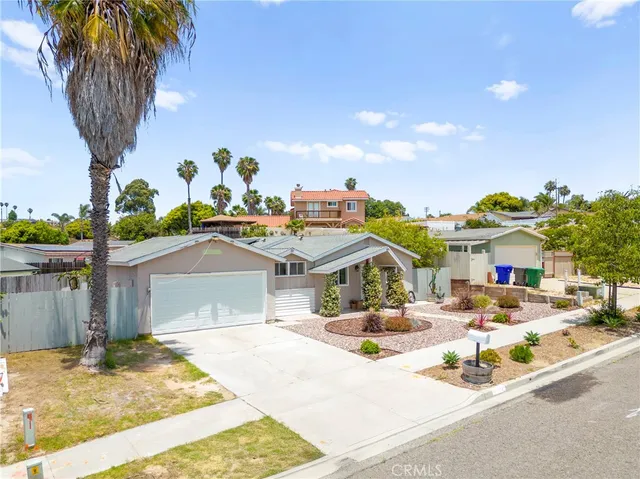 an aerial view of residential house with outdoor space and parking