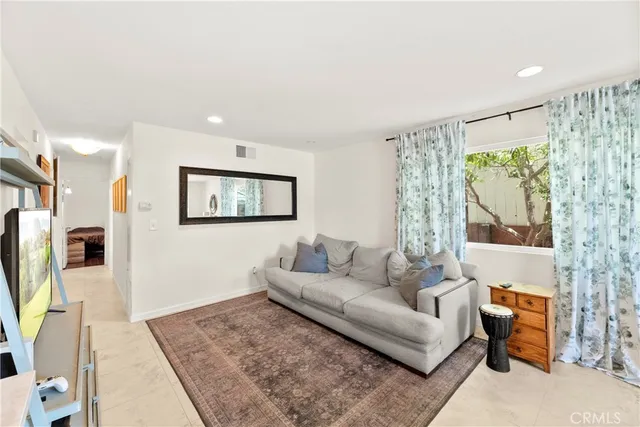 a kitchen with refrigerator and cabinets