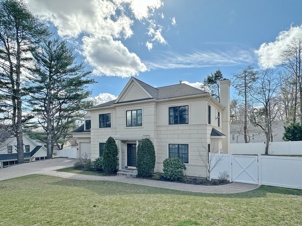 9 Vine Street Newton, MA 02467 - Photo 1 of 1 a view of a white house with a yard and large tree