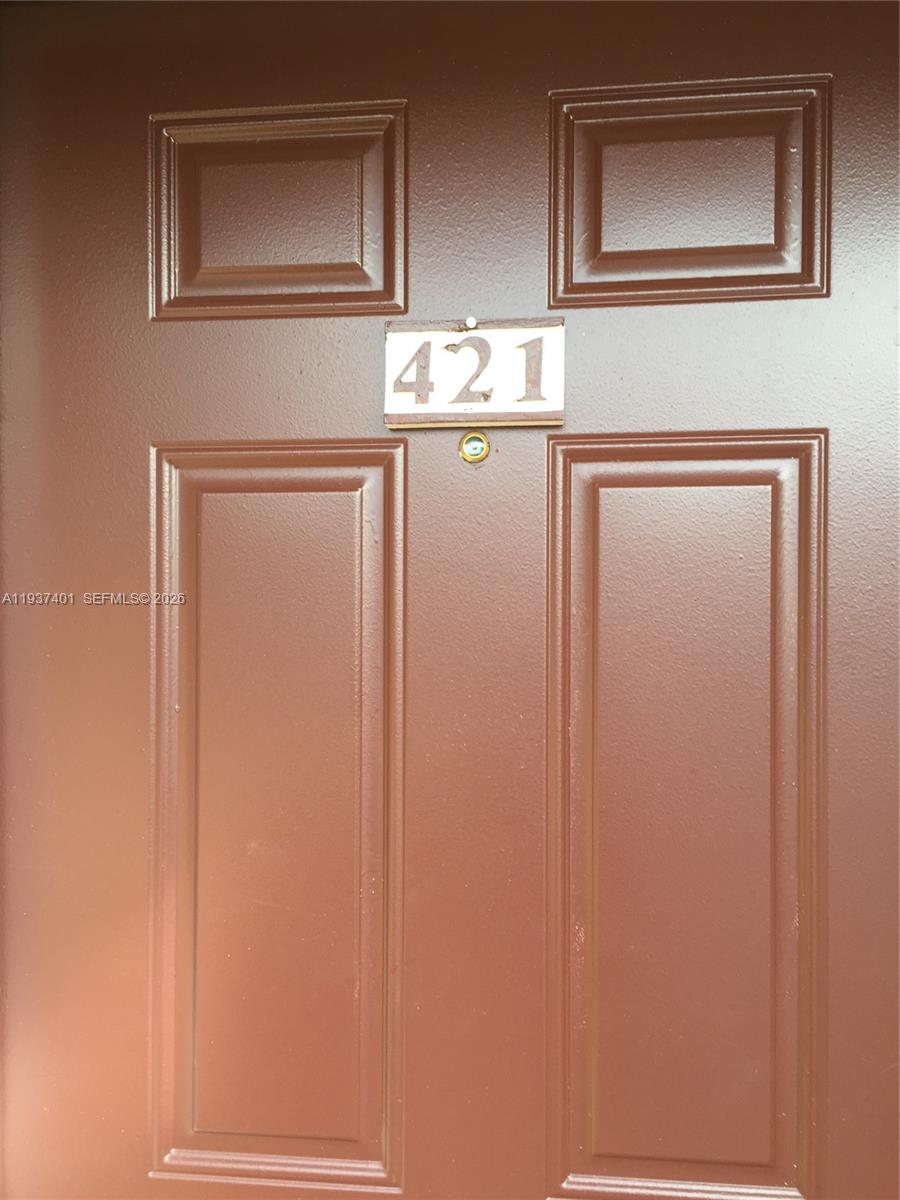 10441 Southwest 156th Court, Unit 421 Miami, FL 33196 - Photo 2 of 36 a bathroom with a sink and a mirror