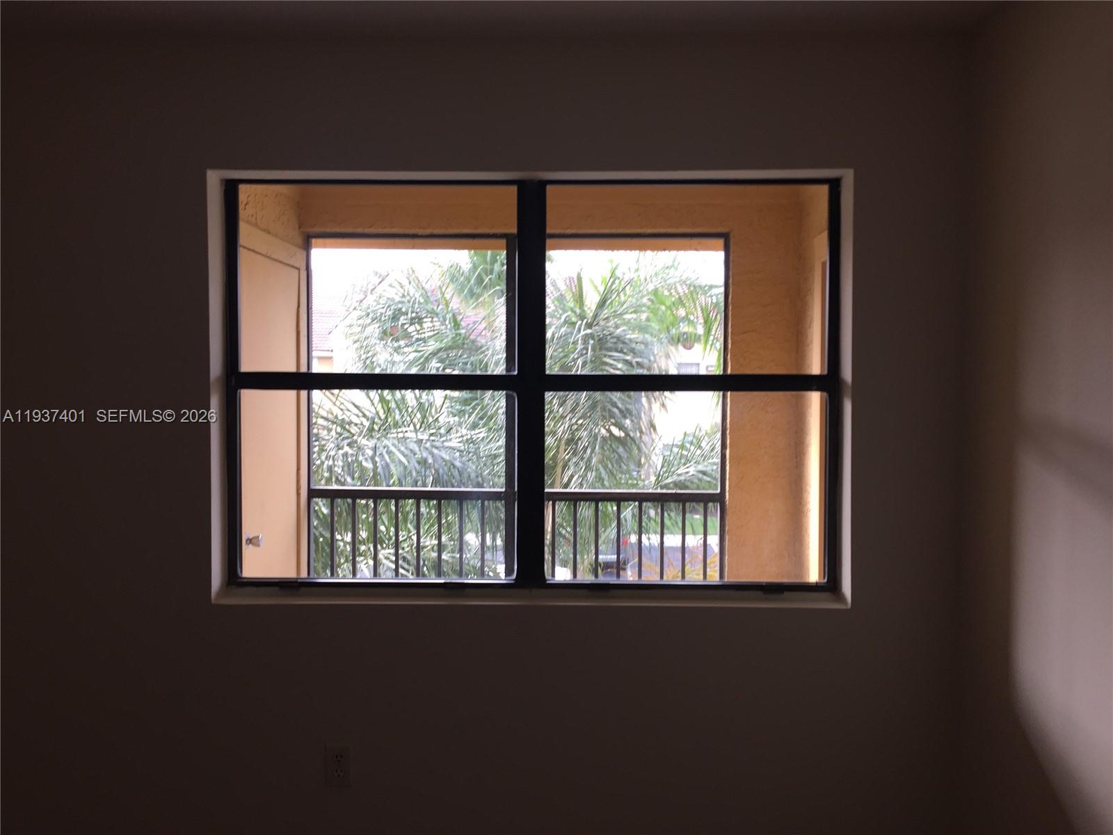 10441 Southwest 156th Court, Unit 421 Miami, FL 33196 - Photo 24 of 36 a view of an empty room with a window