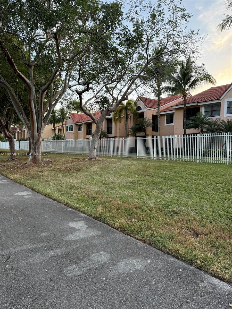 10441 Southwest 156th Court, Unit 421 Miami, FL 33196 - Photo 36 of 36 a view of a house with a yard