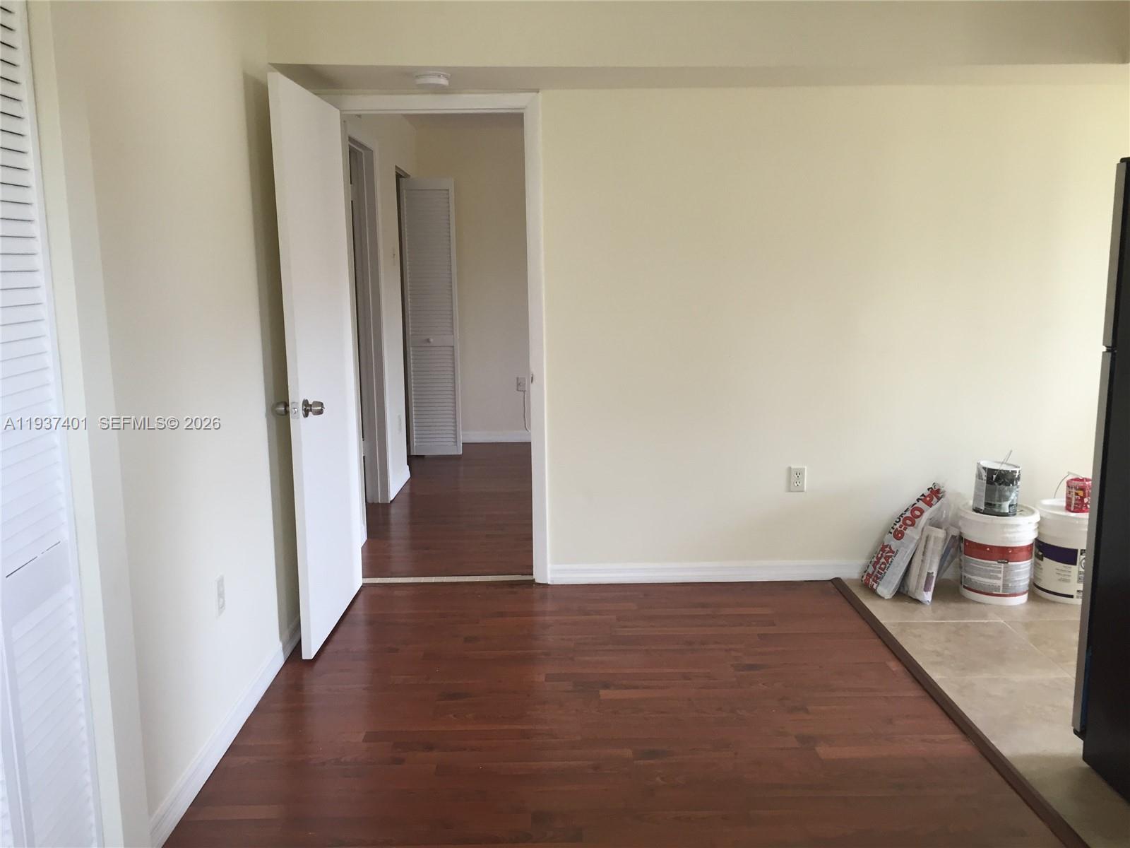 10441 Southwest 156th Court, Unit 421 Miami, FL 33196 - Photo 9 of 36 a view of hallway with wooden floor