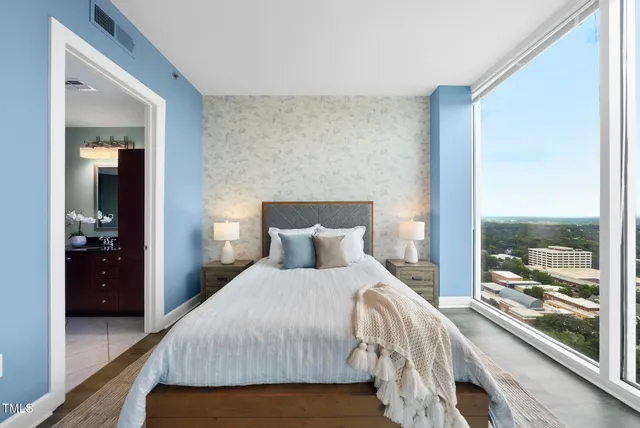 a bedroom with a bed and ceiling fan