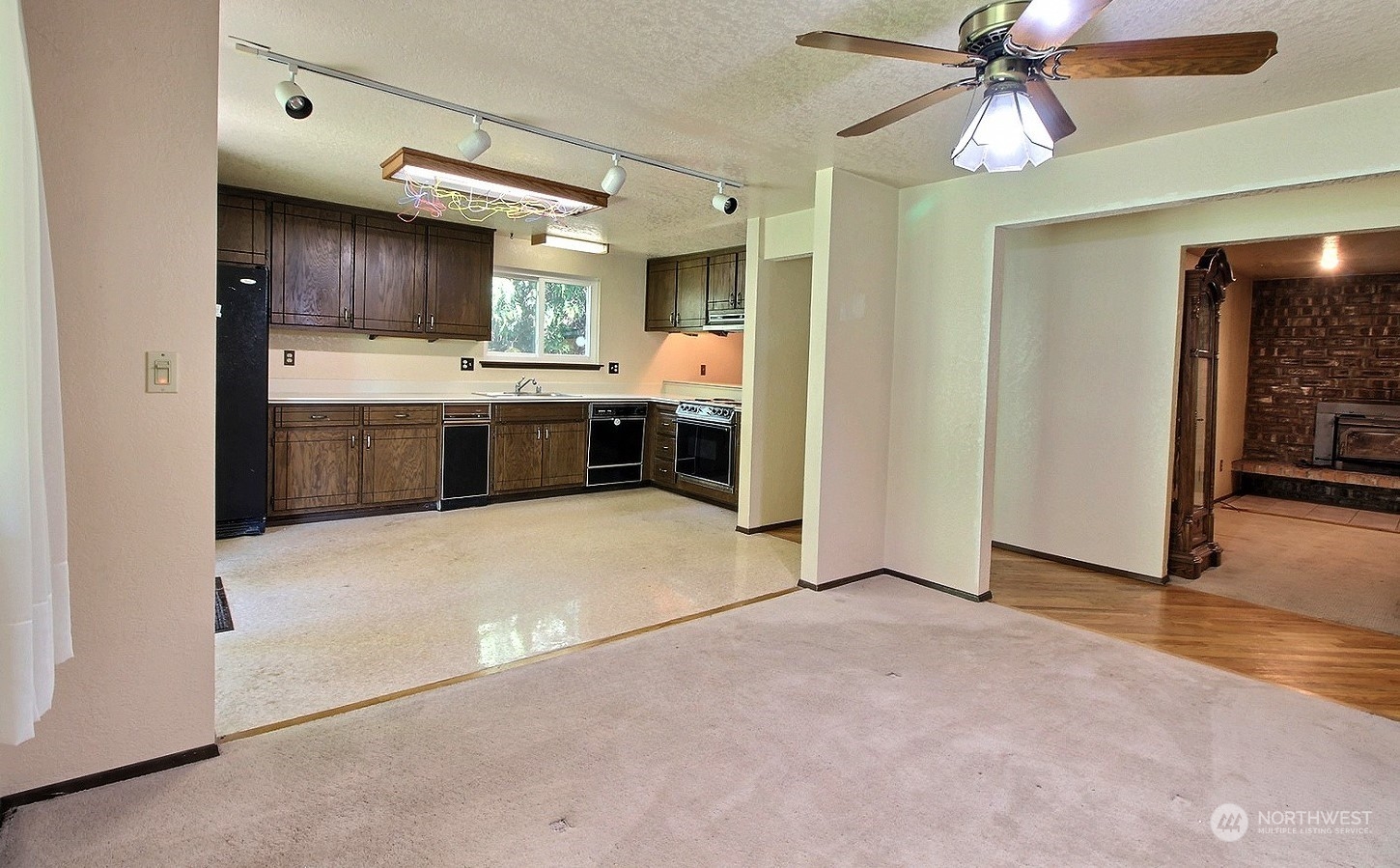21123 West Richmond Road Bothell, WA 98021 - Photo 6 of 29 a large kitchen with a stove a sink and a refrigerator