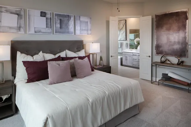 a bedroom with bed and window