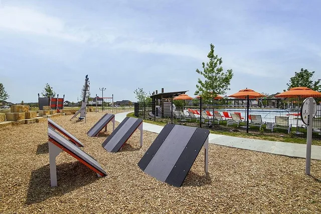 a view of a patio with couches potted plants and a table and chairs