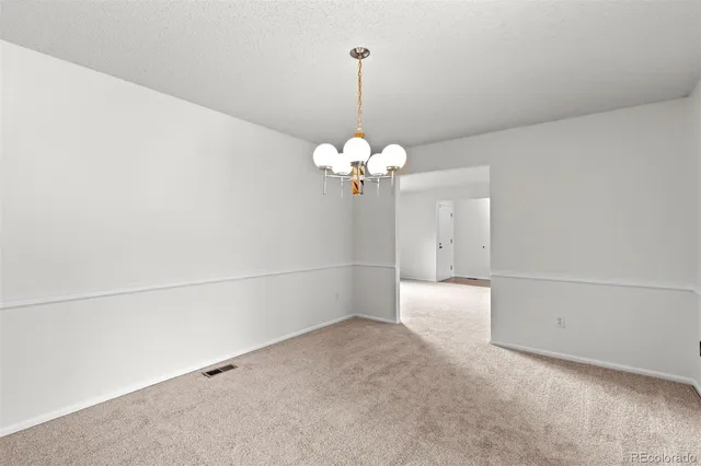 a view of a chandelier in big room