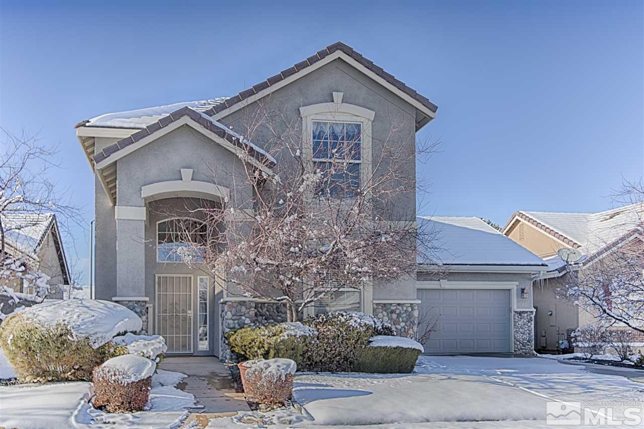 10221 Wolf Ridge Way Reno, NV 89521 - Photo 1 of 1 a front view of a house with garden