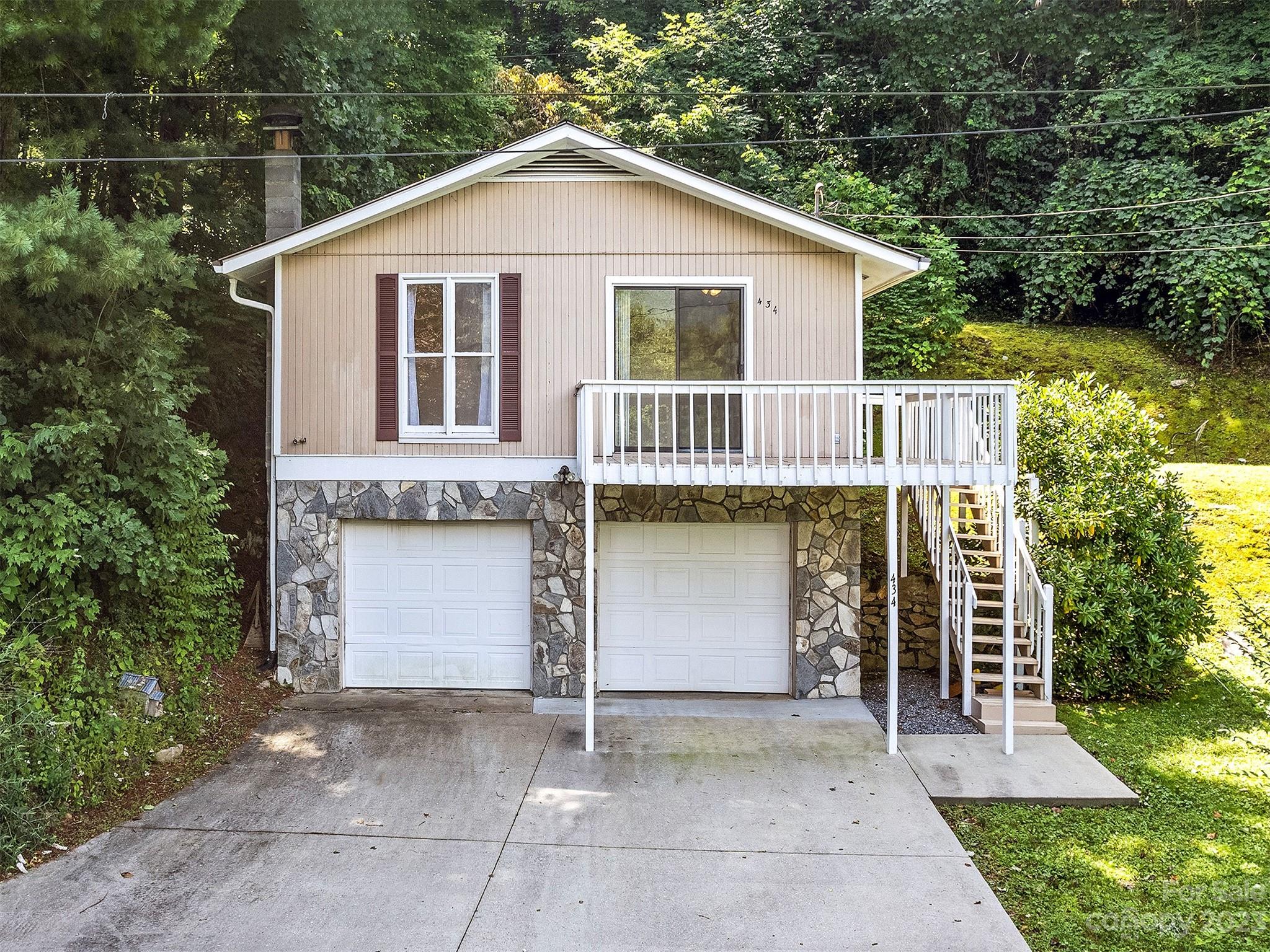434 Red Bank Road Waynesville, NC 28786 - Photo 1 of 30 a view of a house with a yard and wooden fence