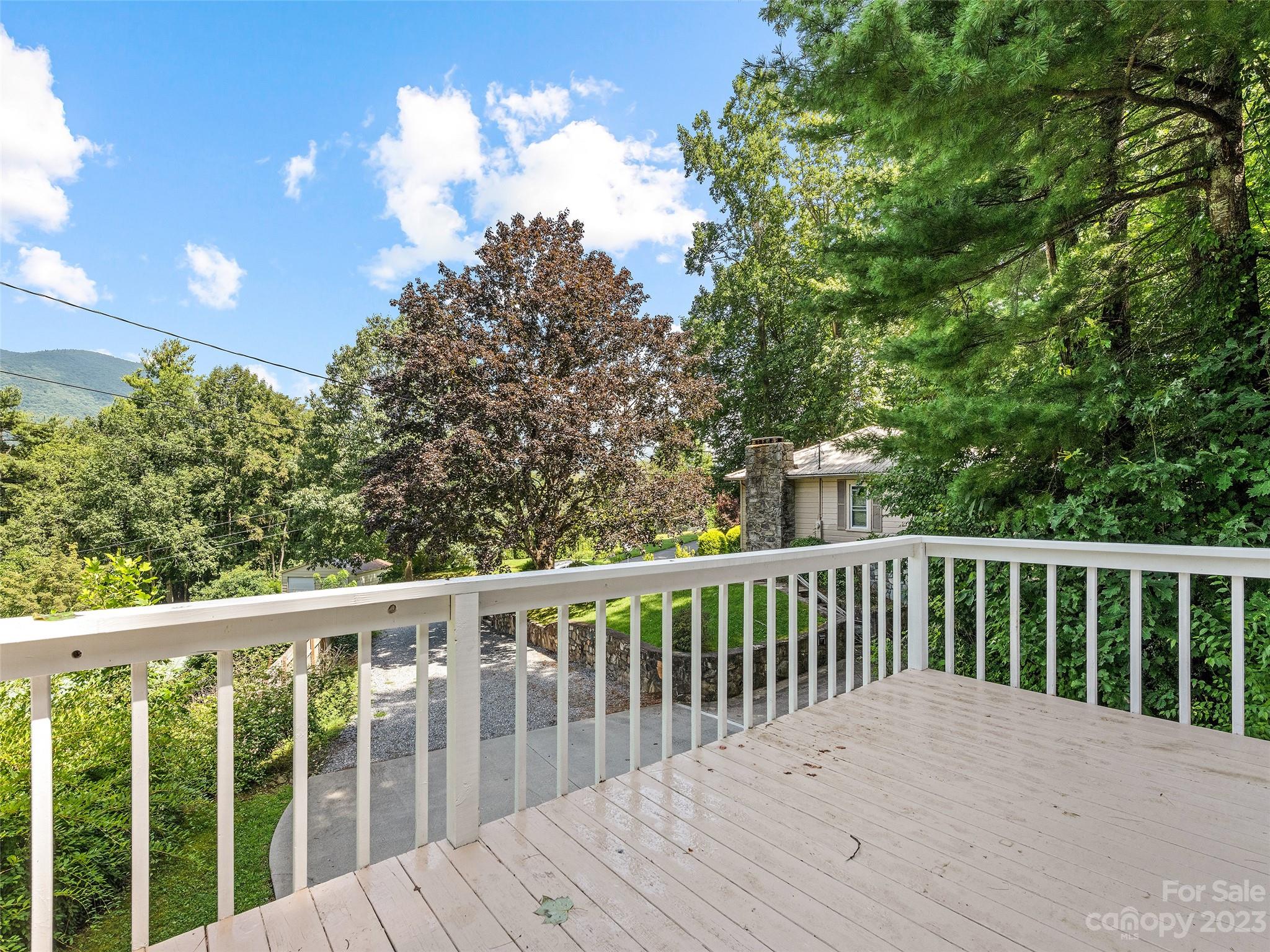 434 Red Bank Road Waynesville, NC 28786 - Photo 13 of 30 a balcony with wooden floor and fence