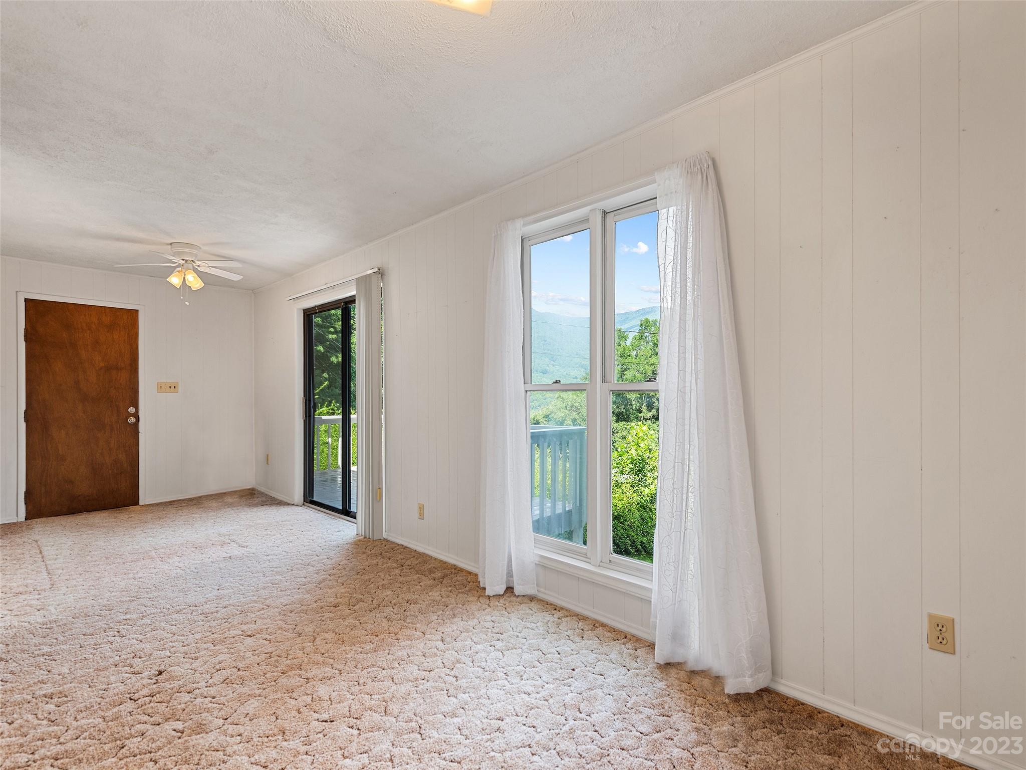 434 Red Bank Road Waynesville, NC 28786 - Photo 19 of 30 a view of an empty room with closet and a window