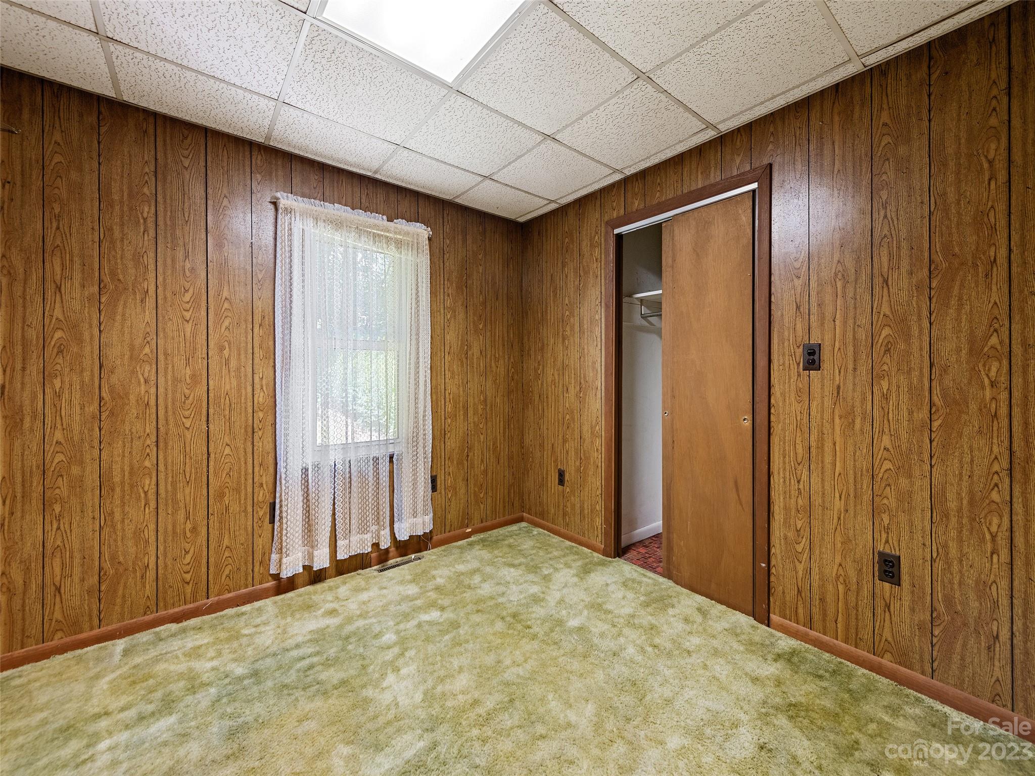 434 Red Bank Road Waynesville, NC 28786 - Photo 22 of 30 a view of an empty room with window and door