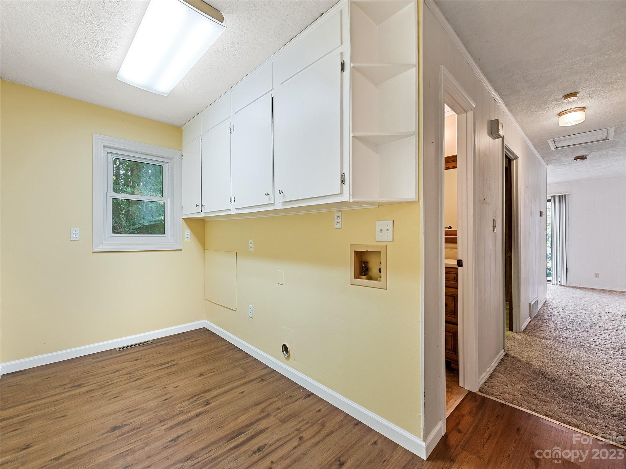 434 Red Bank Road Waynesville, NC 28786 - Photo 28 of 30 a view of a hallway with wooden floor and cabinet