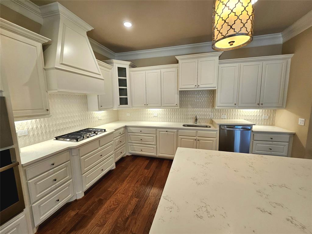 457 Watermere Drive Southlake, TX 76092 - Photo 1 of 1 a kitchen with stainless steel appliances a stove a sink and a refrigerator