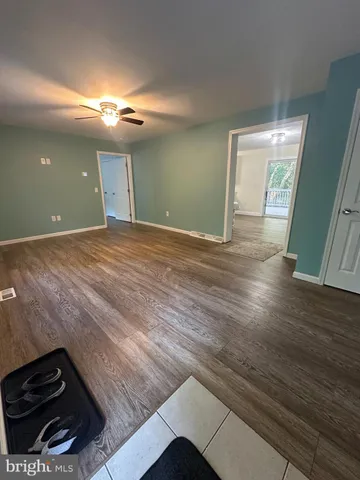 a view of a livingroom with wooden floor