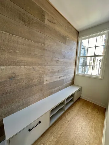a view of wooden floor with a chair