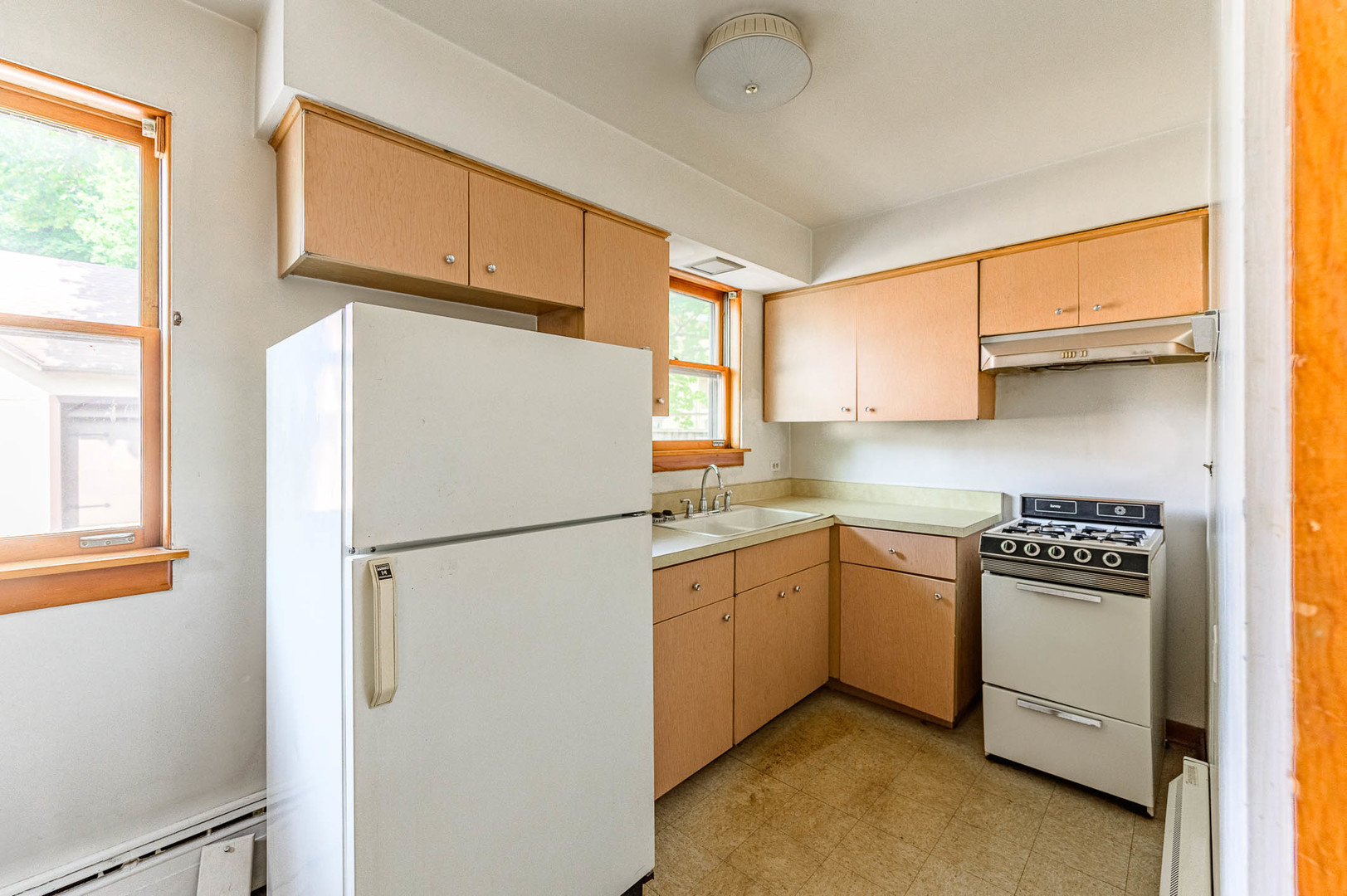 104 Washington Road Lake Forest, IL 60045 - Photo 4 of 17 a white refrigerator freezer sitting in a kitchen